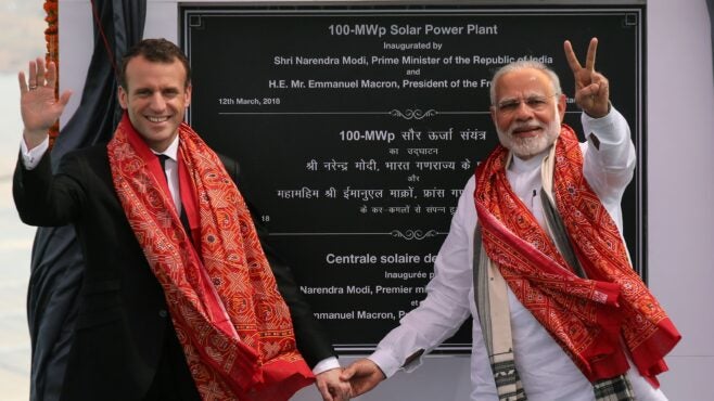 Indian Prime Minister Narendra Modi and French President Emmanuel Macron at the opening of a solar power plant in  2018. (Photo by LUDOVIC MARIN/AFP via Getty Images)