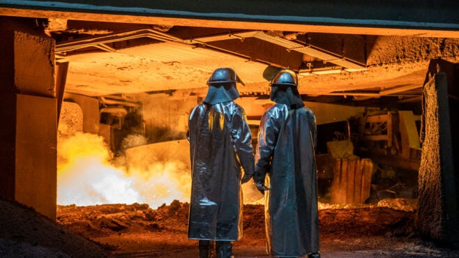 steel-workers-in-front-of-blast-furnace