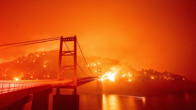 Bidwell Bar Bridge in Northern California surrounded by fire