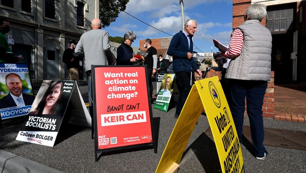 Voters arrive at a pre-polling centre in Melbourne on May 9, 2022, to cast an early vote for the Australian national elections.
