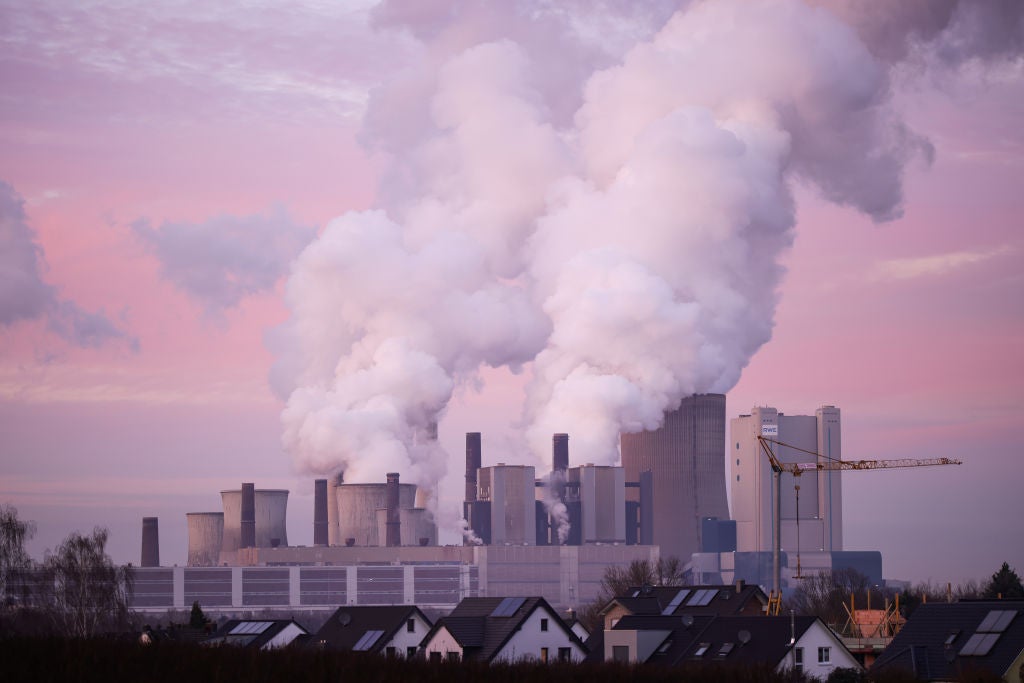 Steam rises from cooling towers of the Niederaussem coal-fired power plant by twilight on January 11, 2022 in Niederaussem, Germany. Part of the power plant serves as the German government's fossil fuel reserve