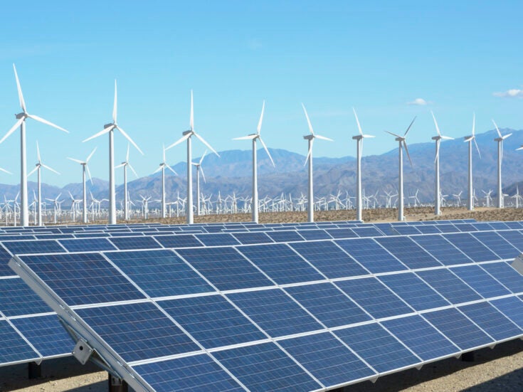 Photovoltaic-solar-panels-palm-springs and wind turbines, San Gorgonio Pass Wind Farm, Palm Springs, California, USA. This solar installation has a 2.3 MW capacity