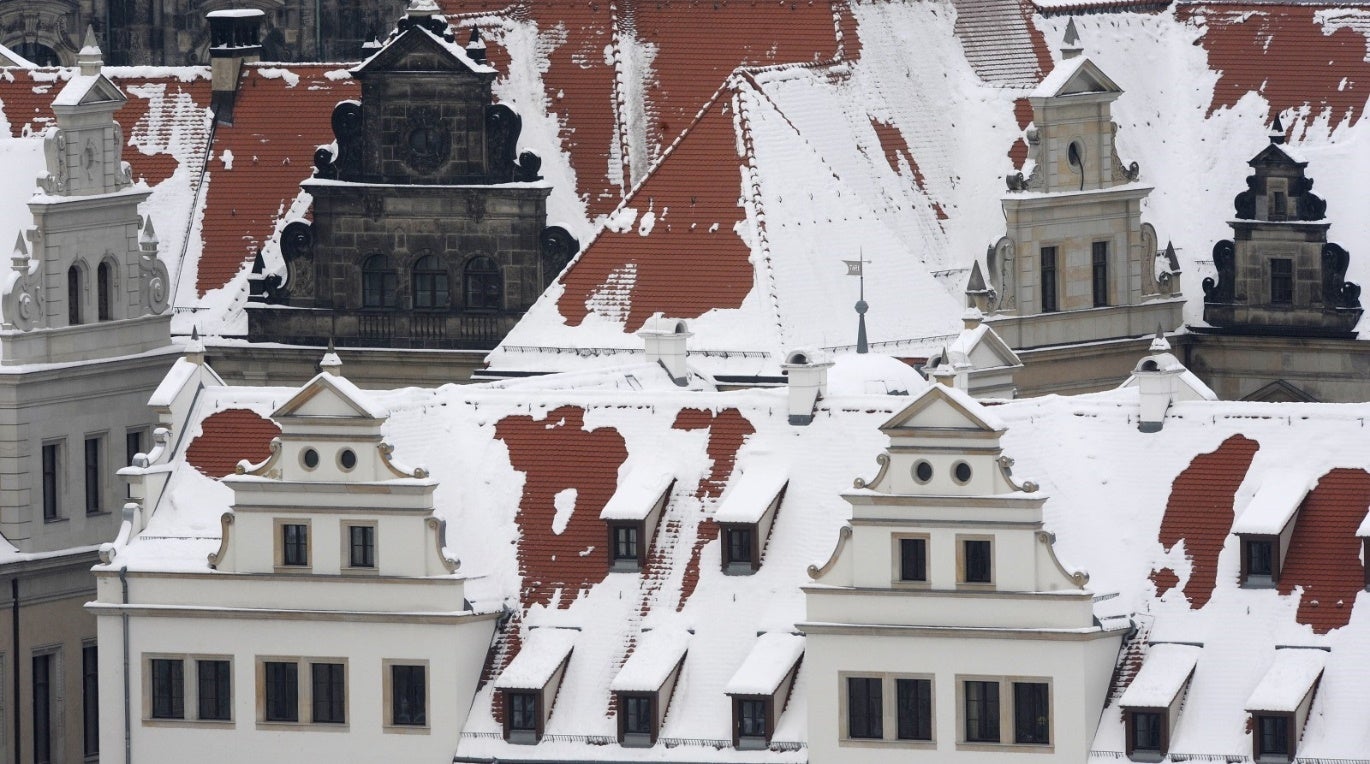 A group of buildings covered in snow
Description automatically generated with medium confidence