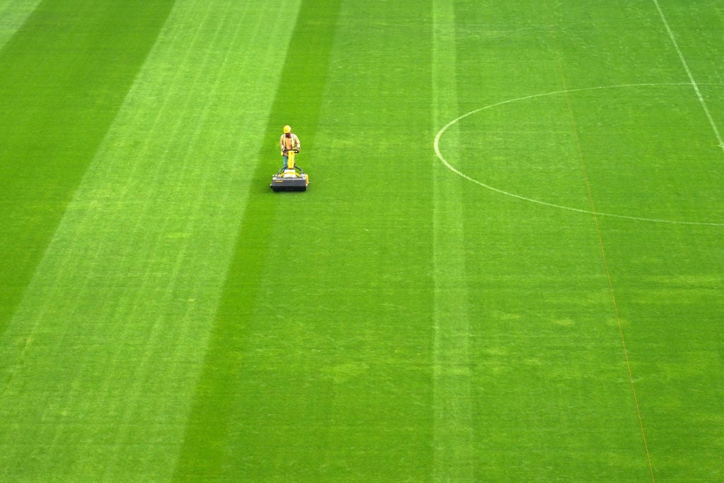 The pitch of Al Bayt Stadium, build for the 2022 World Cup, under construction on December 17, 2019 in Al khor, Qatar. Grass seeds were flown in from the US, contributing to the high carbon footprint of the event. (Photo by Etsuo Hara via Getty Images)